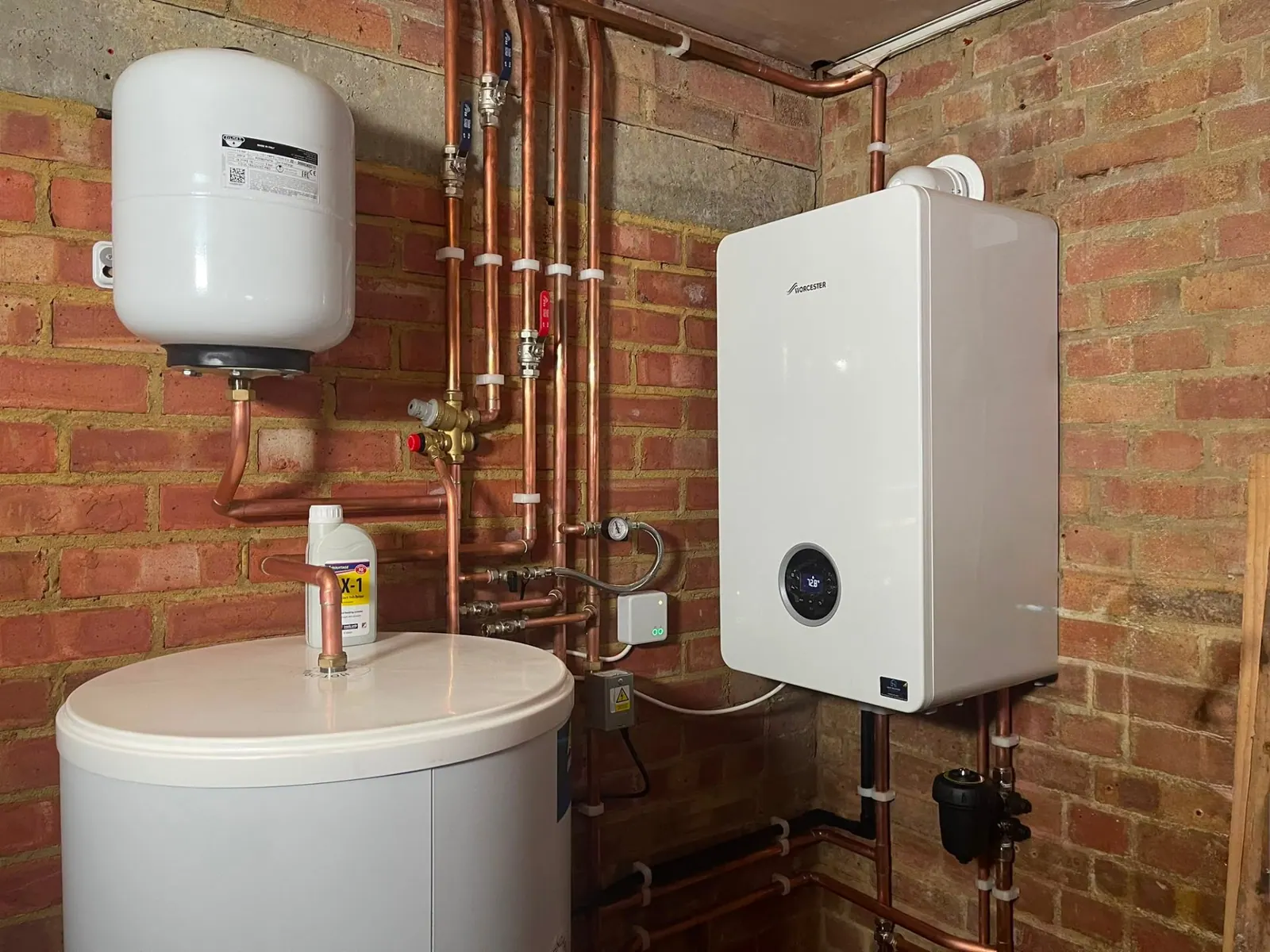 Vaillant boiler installation with copper pipework in a Surrey utility area