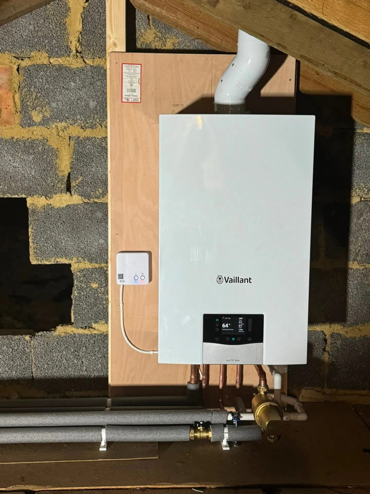 Vaillant boiler swap on a chimney breast with tidy pipe drops, Surrey