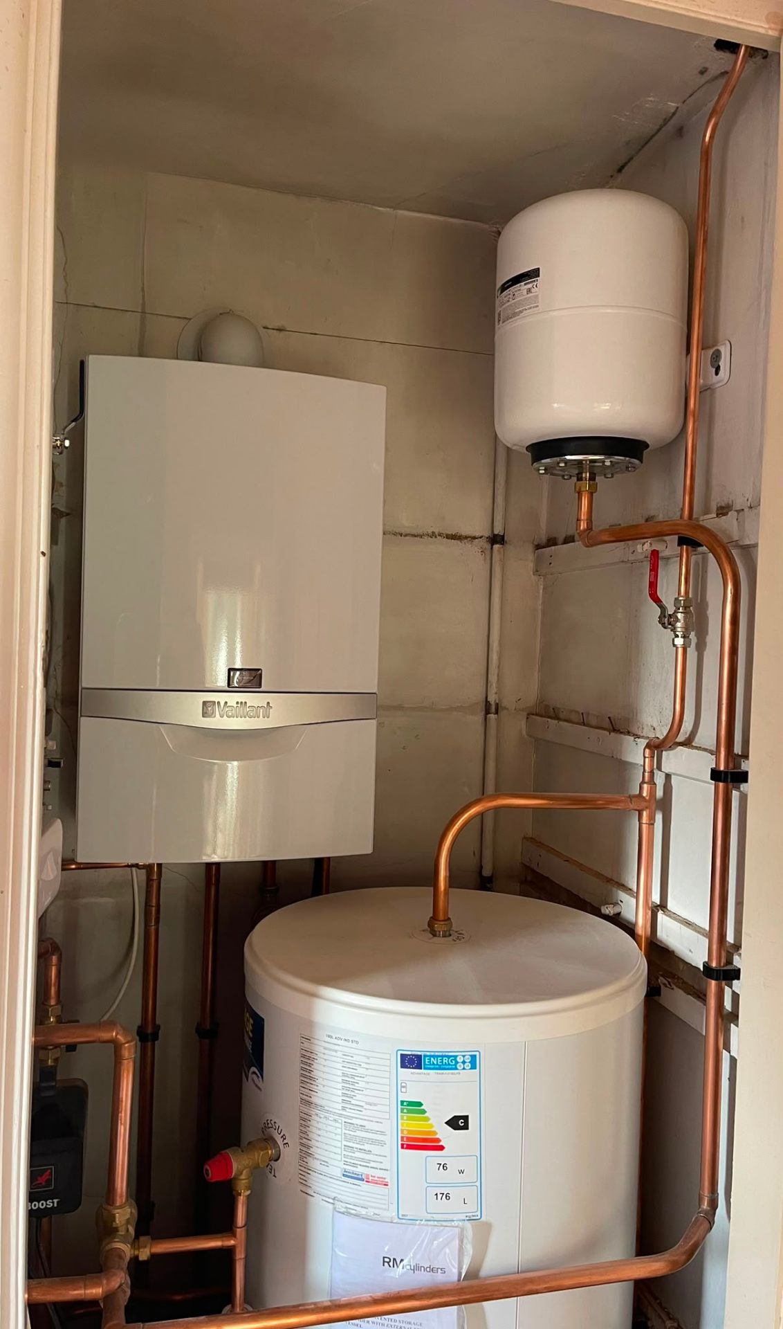 Compact cylinder and boiler central heating plant in a cupboard, Ashford