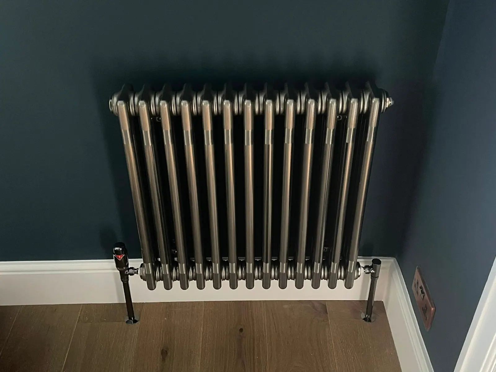 Traditional column radiator installation on a feature wall by Heat Solution London