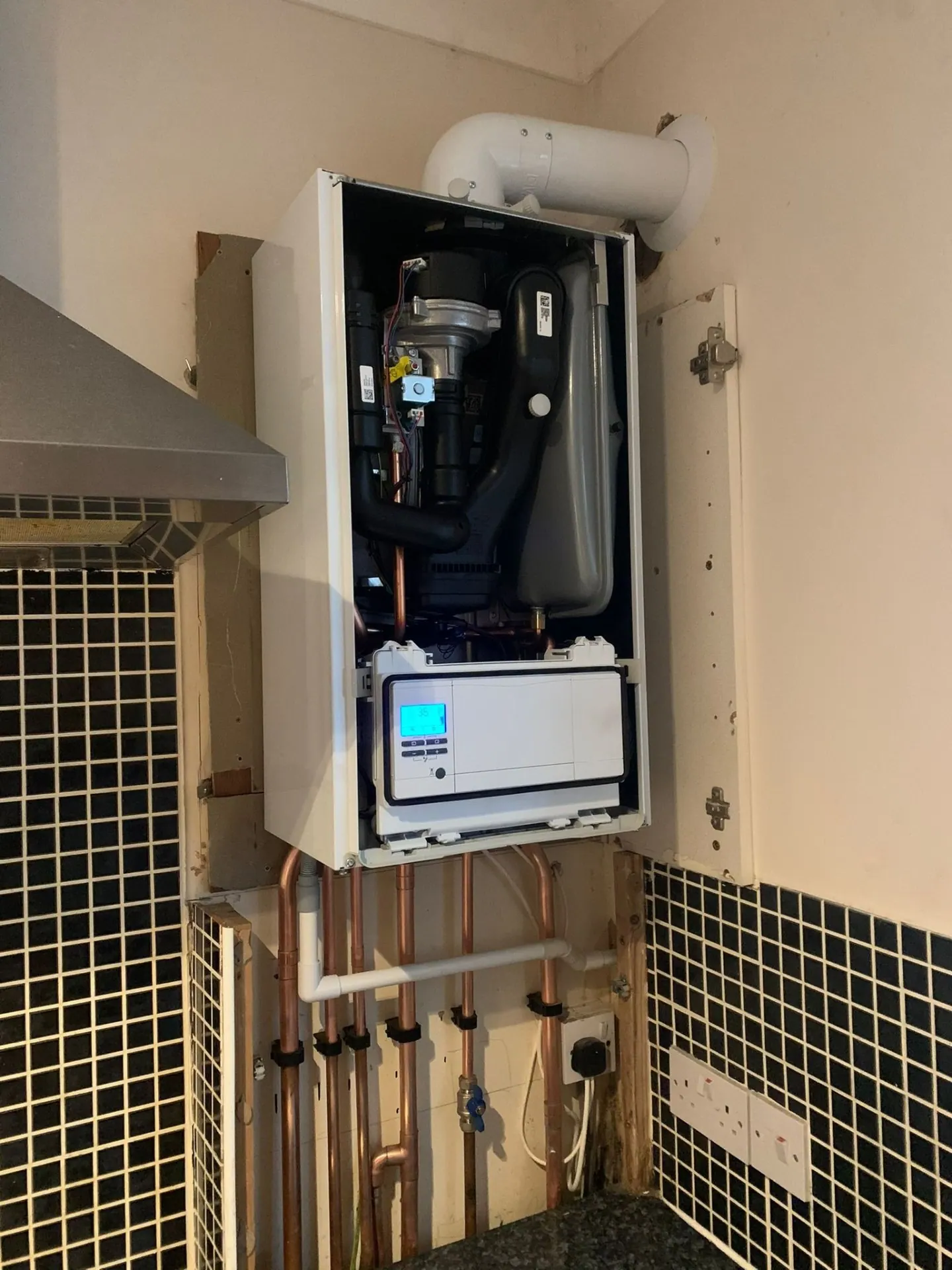 Vaillant combi boiler installation with tidy copper pipework by Heat Solution London in Ashford, Surrey