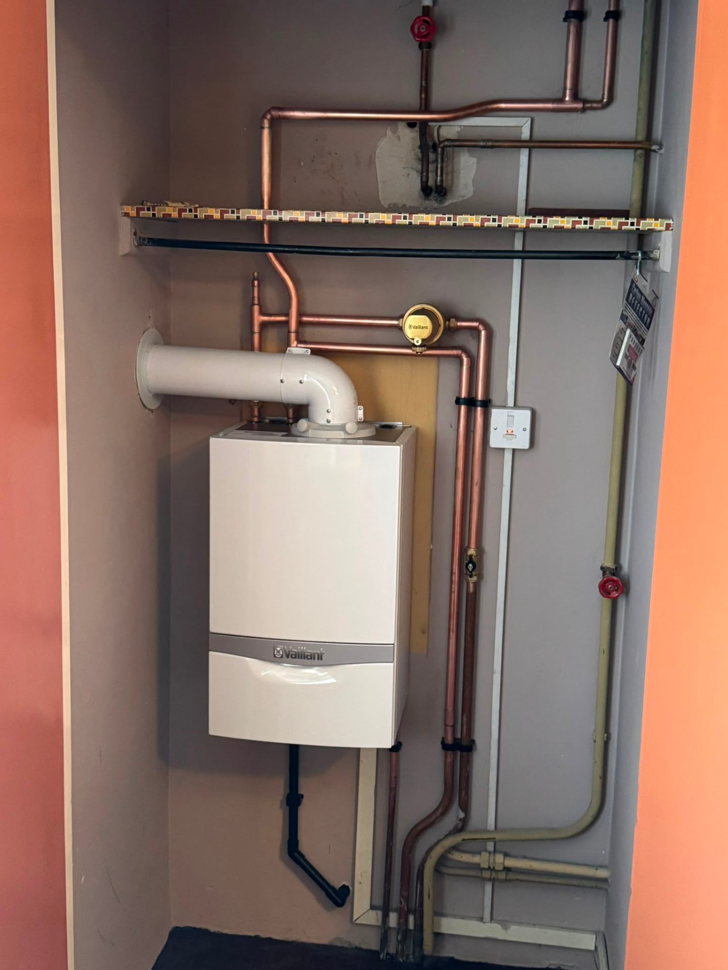 New boiler installation with re-routed copper flow and return pipework in Surrey
