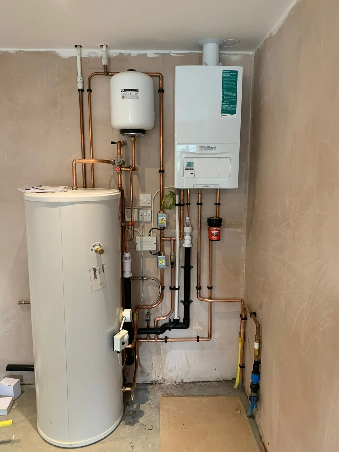 Full central heating installation with unvented cylinder, magnetic filter and copper pipework in Surrey